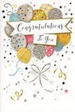 The photograph presents a stylish congratulations card that radiates soft, uplifting joy, as though it were designed to accompany a bouquet delivered to a doorstep along Berrylands Road. Dominating the front of the card is a cheerful cluster of illustrated balloons, gathered in a loose bouquet and appearing to float gently upward from the lower centre. They are coloured in a coordinated palette of champagne gold, brushed silver, pastel blue, blush pink, cream, and gentle grey, each balloon decorated with twinkling stars, glimmering dots, or subtle vertical stripes that catch the eye like sparkling decorations at a small celebration in a Berrylands garden. The balloons overlap in an artful way, creating a sense of layered depth and fullness, almost as if you could slip your fingers between them. From their bases fall slim metallic ribbons, sketched in sweeping curves of gold and silver, curling playfully like the ends of hand-tied florist ribbon. Across the central part of the card, an elegant banner stretches from side to side, partially tucked behind some balloons, and carries the words Congratulations To You in flowing, ornate handwriting that feels personal and heartfelt. Surrounding this focal arrangement, the softly tinted background is scattered with tiny stars and swirling confetti lines, giving the impression of lightness and movement, as though the air itself is filled with celebration. The card's overall mood is bright yet graceful, ideal for marking life's proud turning points-graduations, promotions, engagements, or new beginnings-within the Berrylands and Surbiton community. You can almost sense the contrast in textures between smooth cardstock, gently raised glitter, and gleaming ink, making the design both visually rich and touchably inviting.